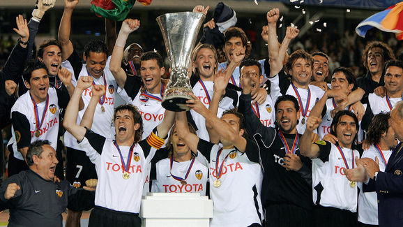 The Valencia team celebrate with the tro